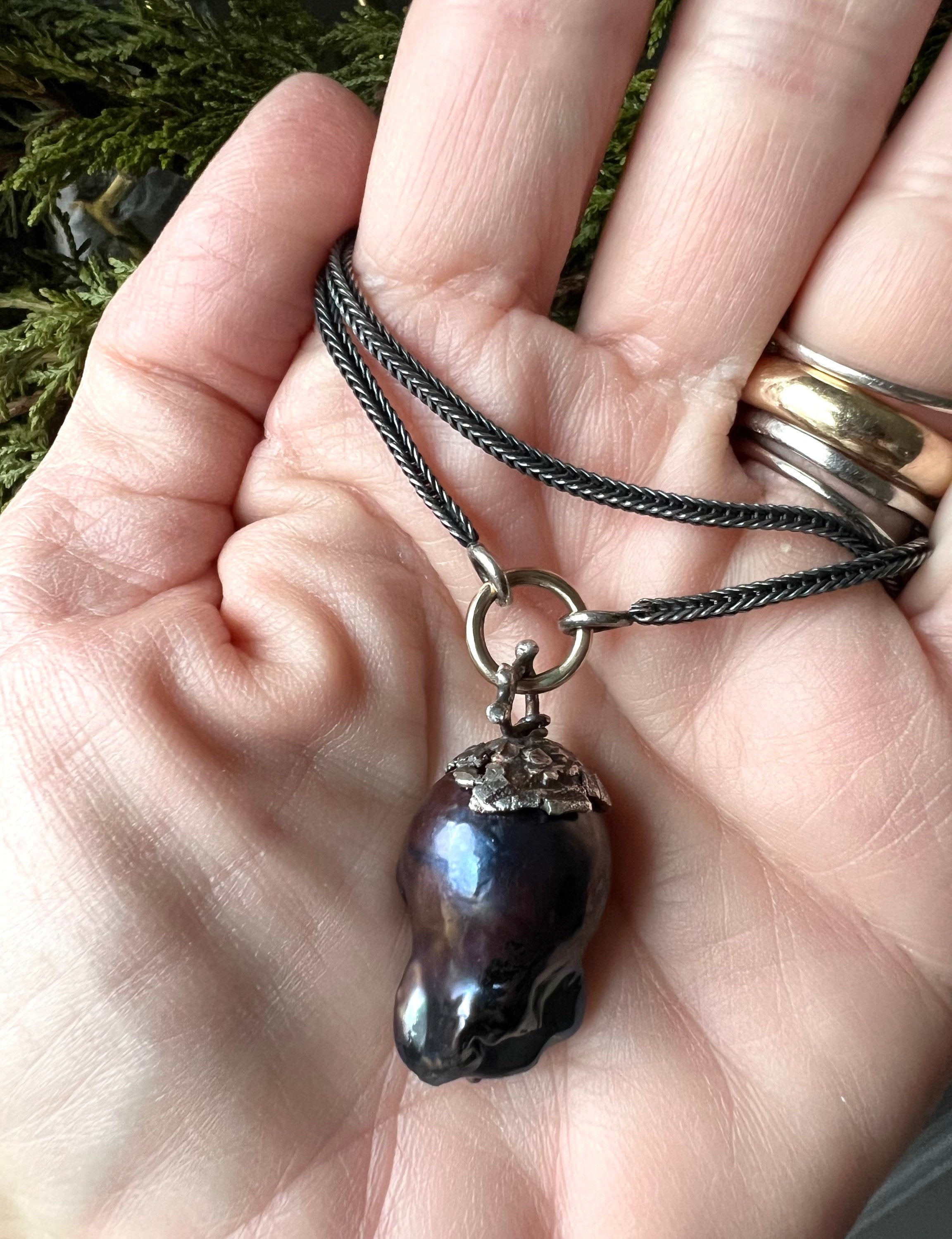 Large Black Baroque Freshwater Pearl on 22” S.Silver Snake Chain with 14K Gold Connector.