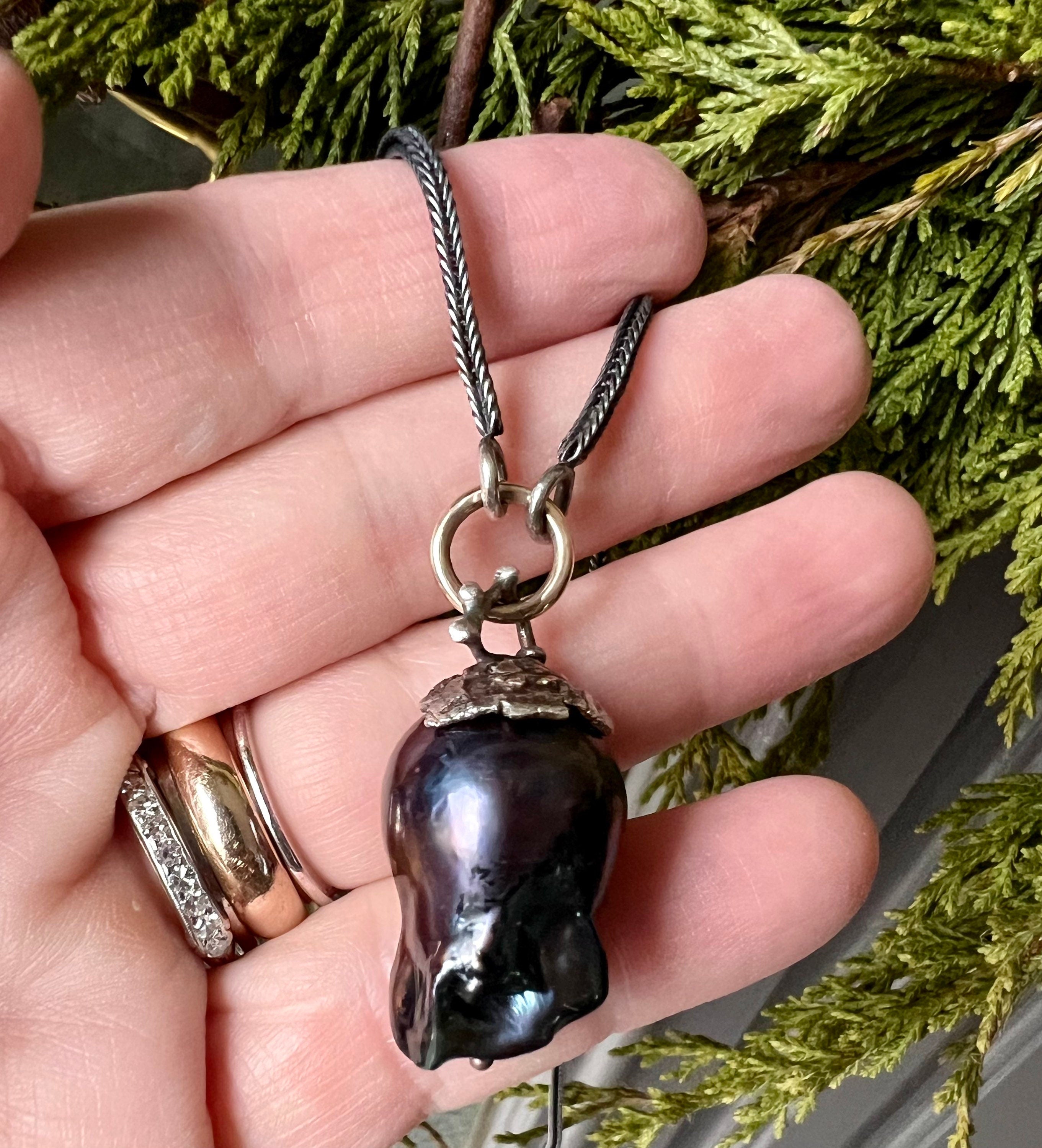 Large Black Baroque Freshwater Pearl on 22” S.Silver Snake Chain with 14K Gold Connector.