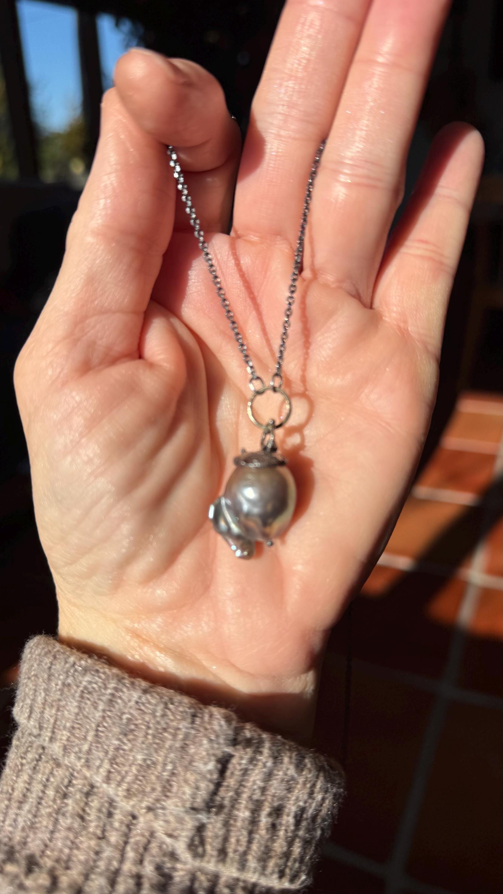Giant Black Baroque Pearl Necklace with Sterling silver Chain and 14k Gold; 24” long.