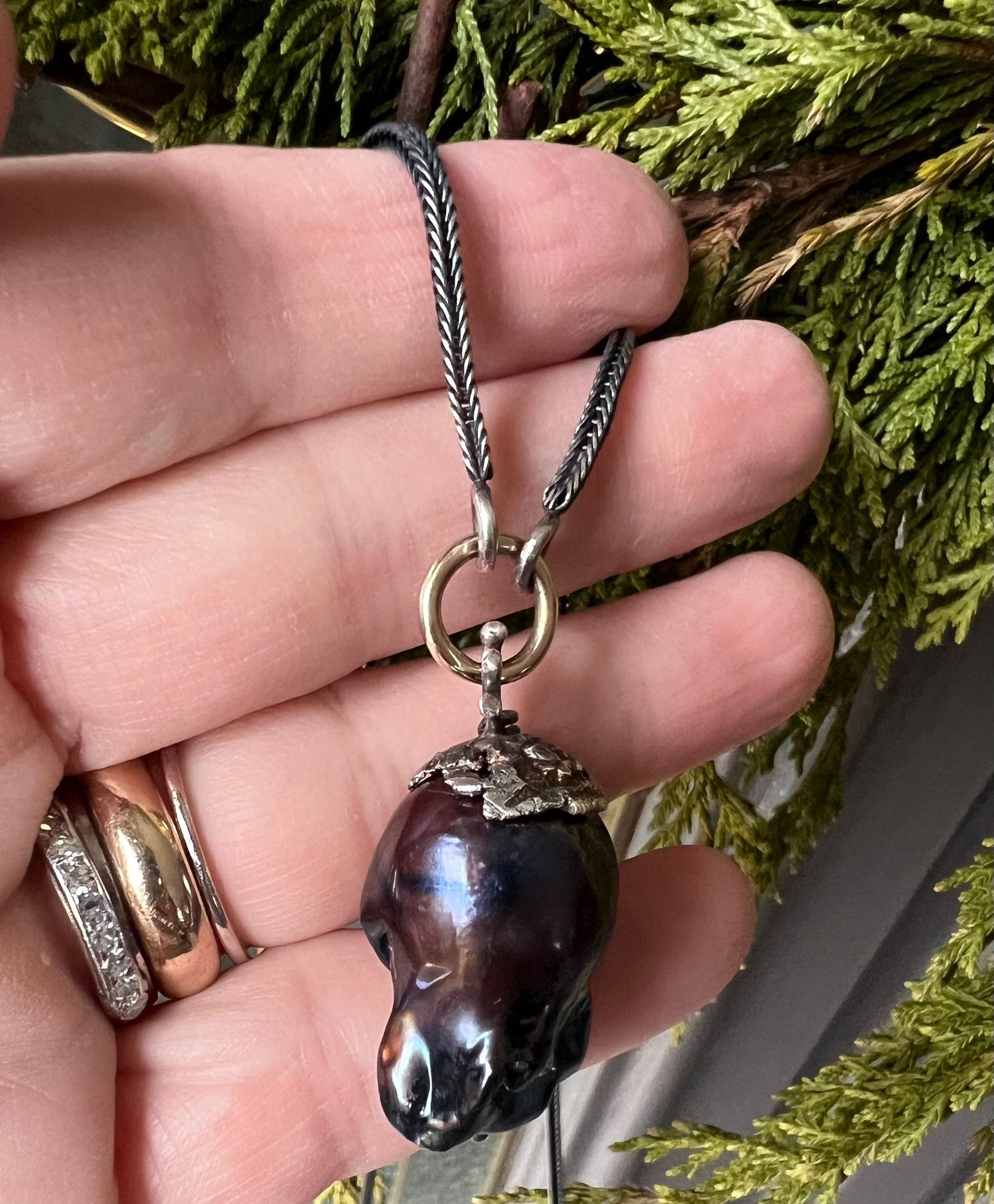 Large Black Baroque Freshwater Pearl on 22” S.Silver Snake Chain with 14K Gold Connector.