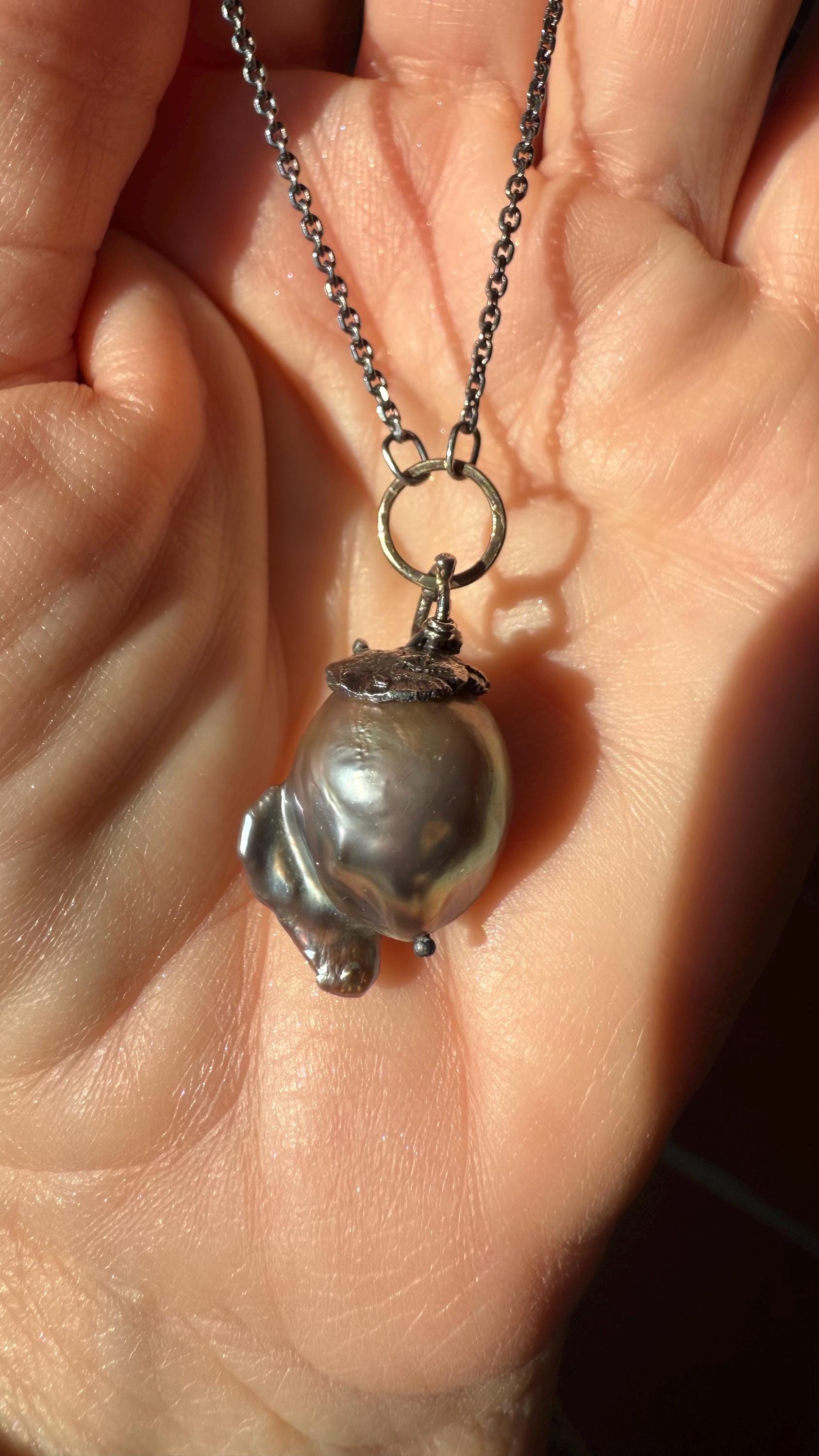 Giant Black Baroque Pearl Necklace with Sterling silver Chain and 14k Gold; 24” long.