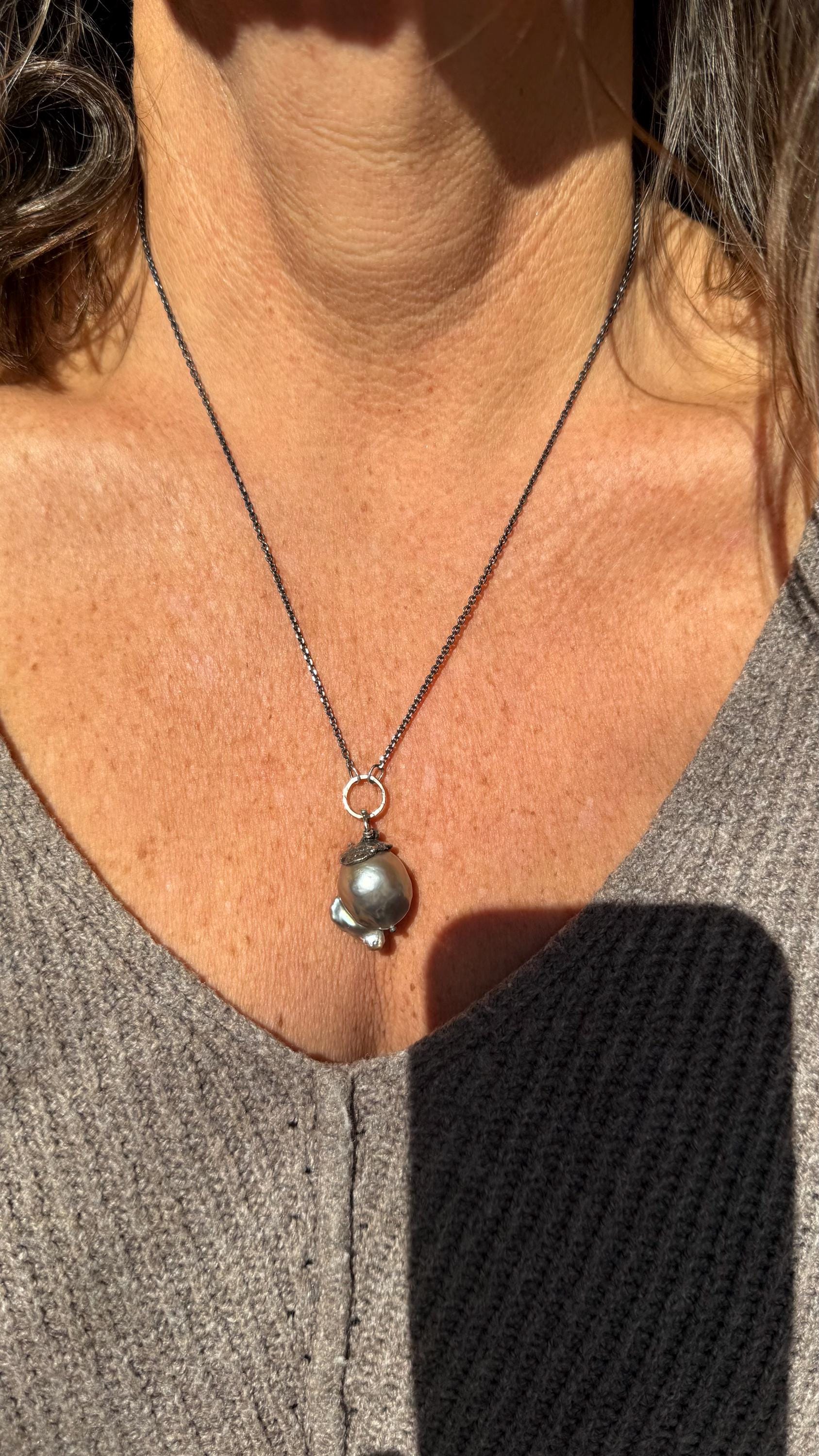 Giant Black Baroque Pearl Necklace with Sterling silver Chain and 14k Gold; 24” long.