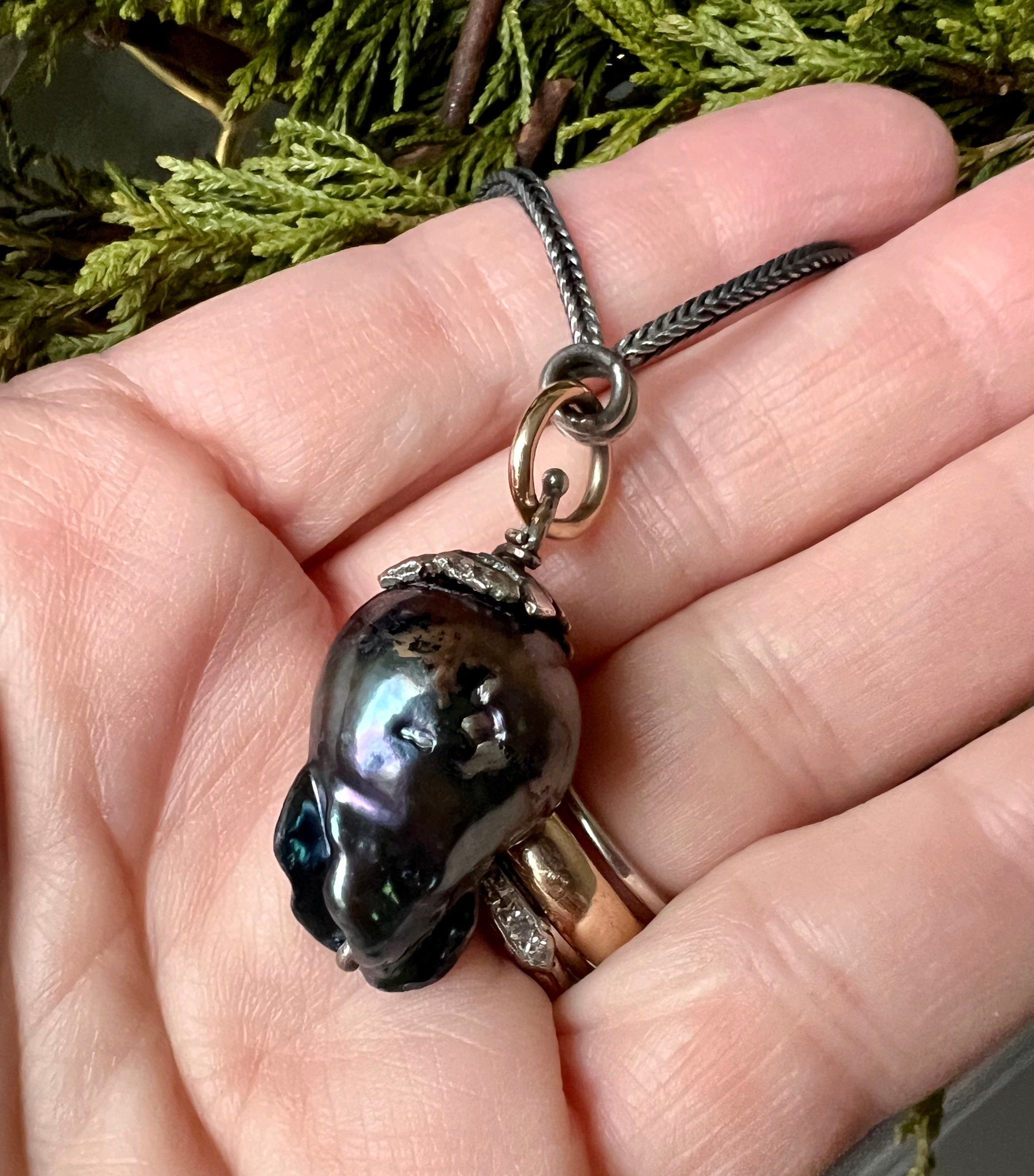 Large Black Baroque Freshwater Pearl on 22” S.Silver Snake Chain with 14K Gold Connector.
