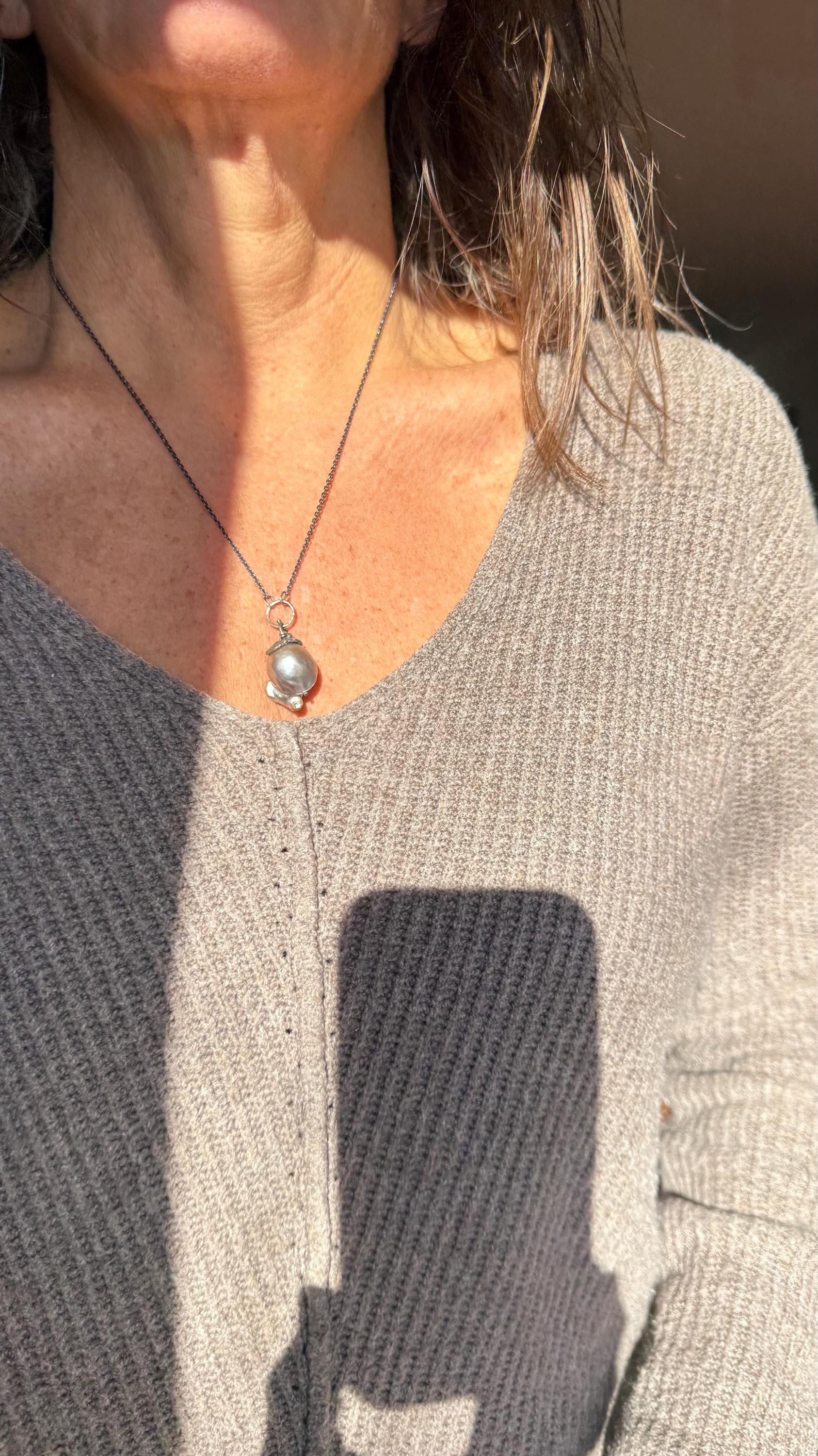 Giant Black Baroque Pearl Necklace with Sterling silver Chain and 14k Gold; 24” long.