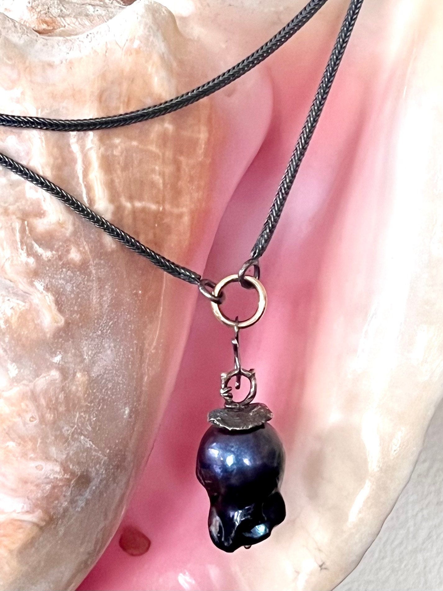 Large Black Baroque Freshwater Pearl on 22” S.Silver Snake Chain with 14K Gold Connector.