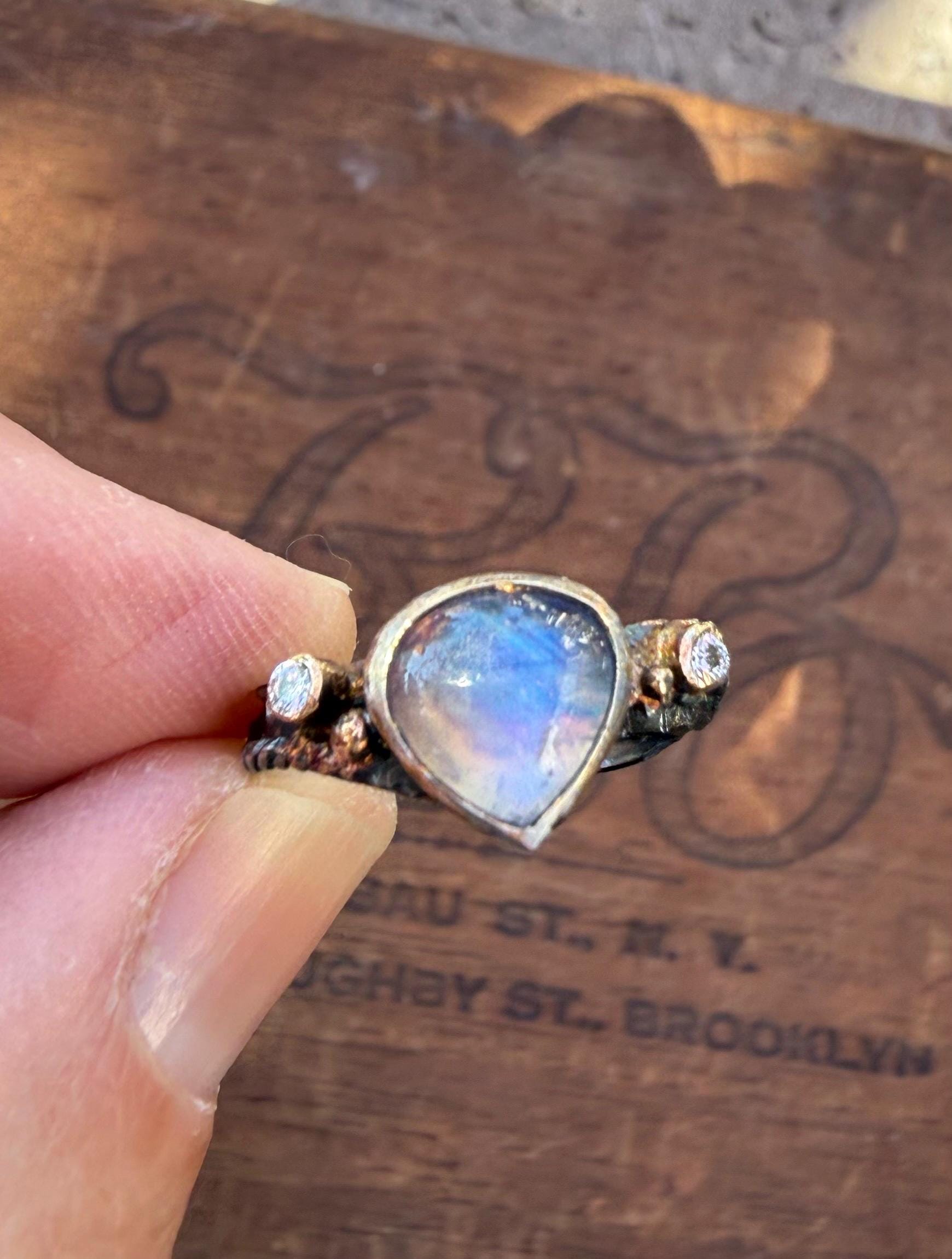 Fused Sterling Silver & 14K+22K Gold with  Flashing Tearsrop Moonstone and 2-2mm Diamonds.