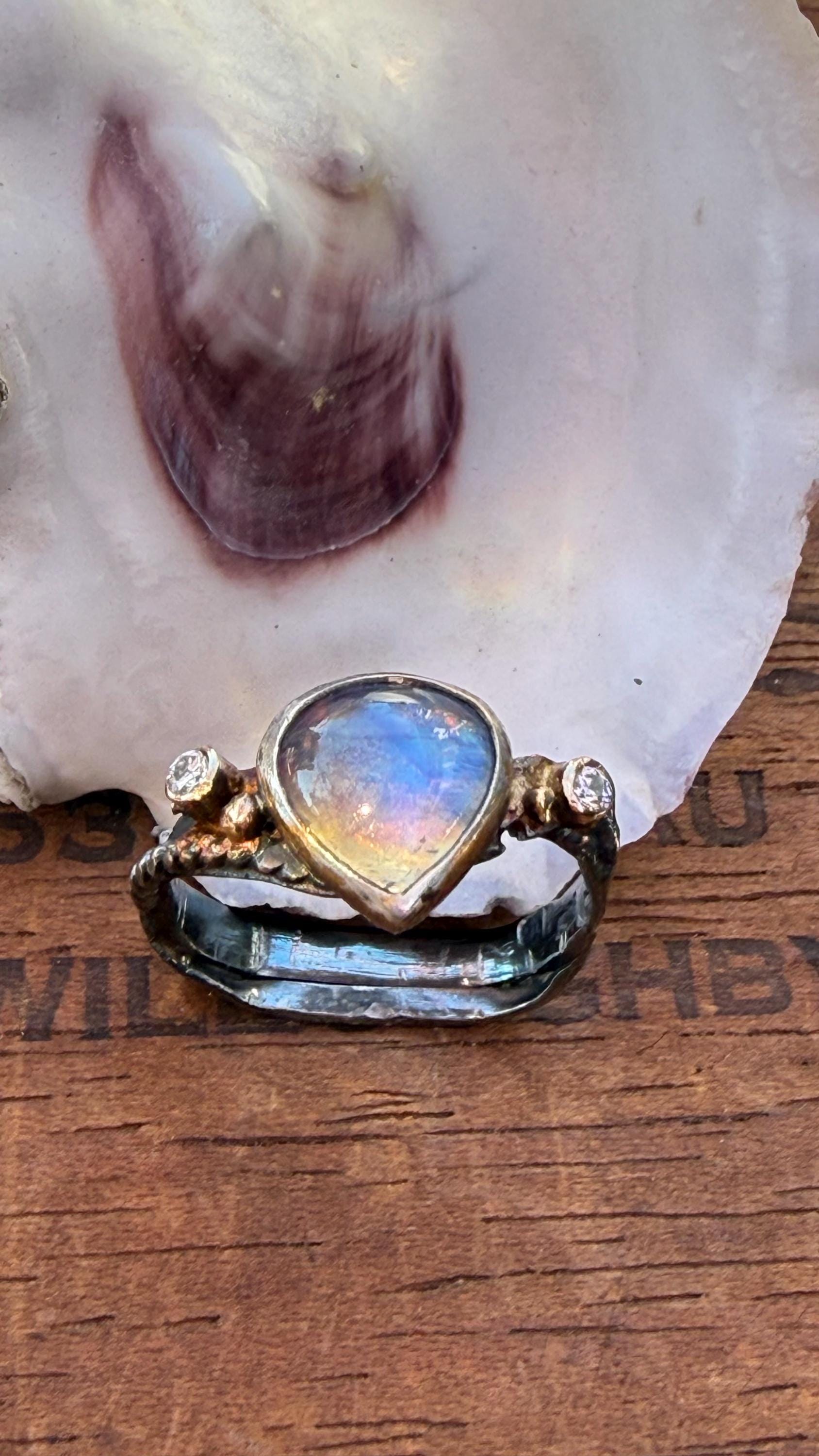 Fused Sterling Silver & 14K+22K Gold with  Flashing Tearsrop Moonstone and 2-2mm Diamonds.