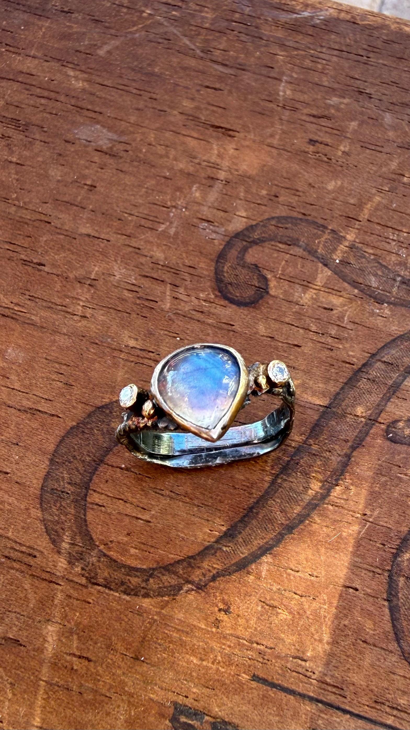 Fused Sterling Silver & 14K+22K Gold with  Flashing Tearsrop Moonstone and 2-2mm Diamonds.